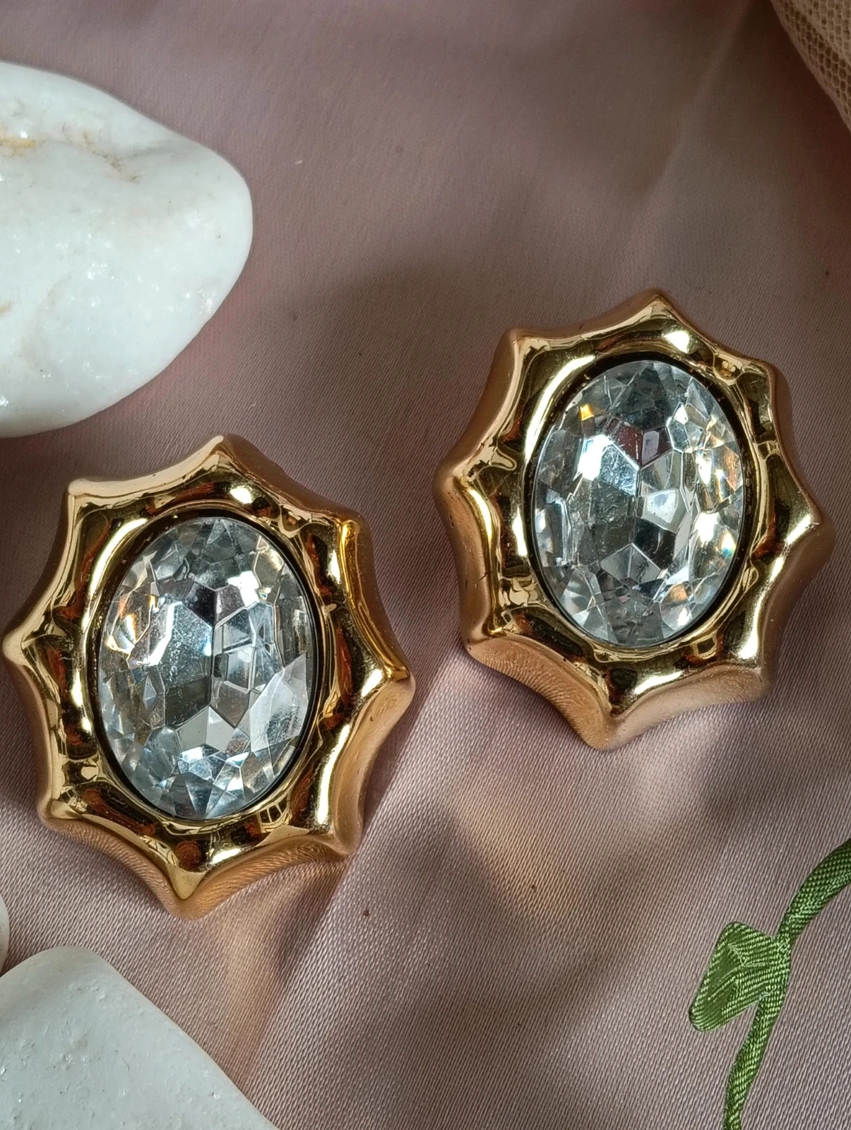 Vintage 80s Oversized gold tone starburst clip on earrings with large facceted crystal