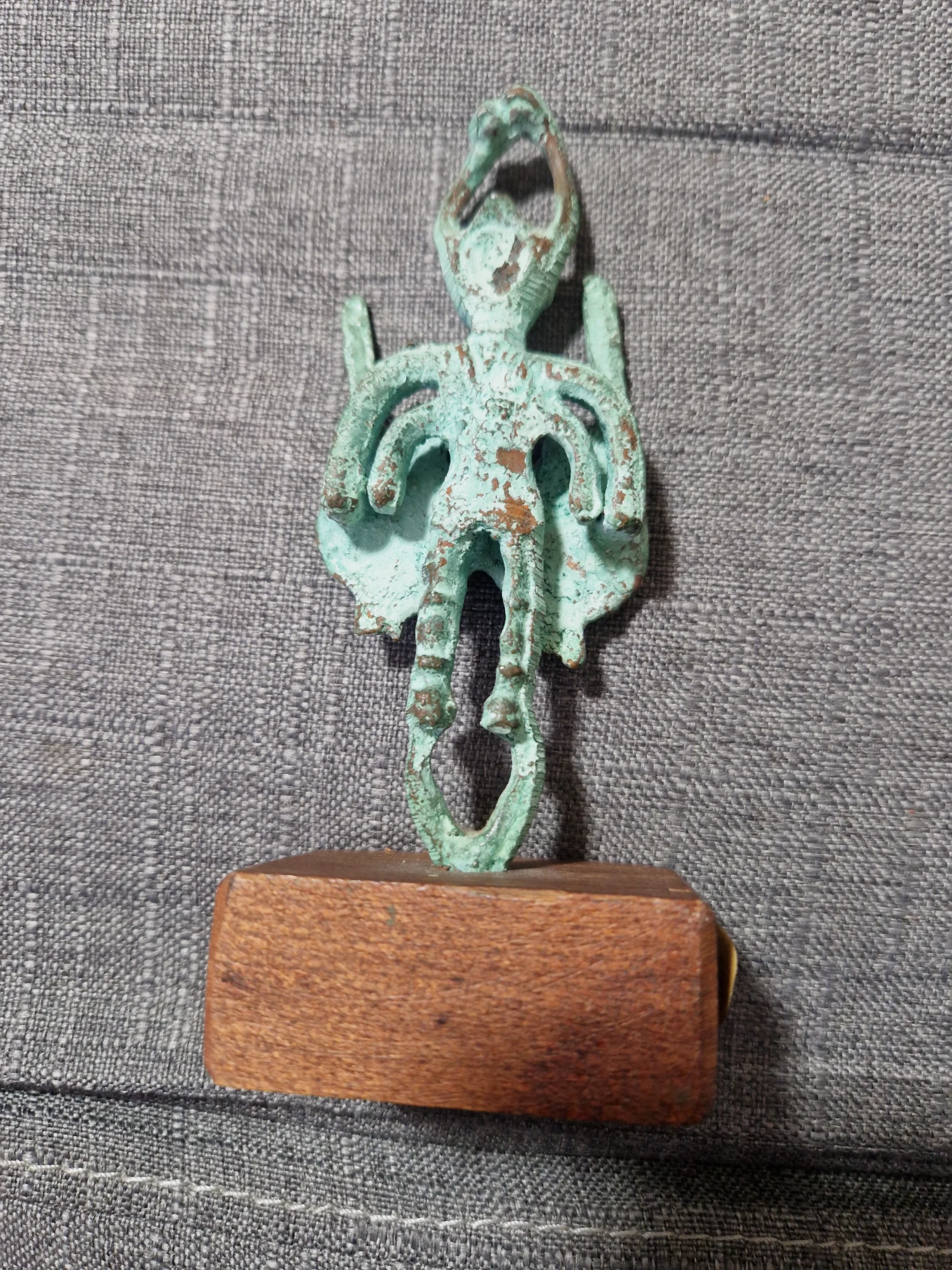 Bronze warrior statuette on wooden base
