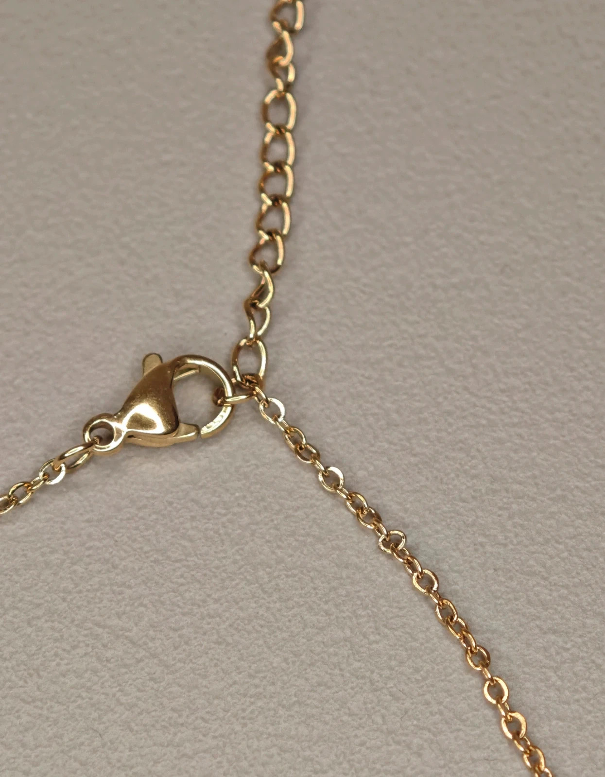 Collier acier inoxydable doré multi plumes et strass brillants 4