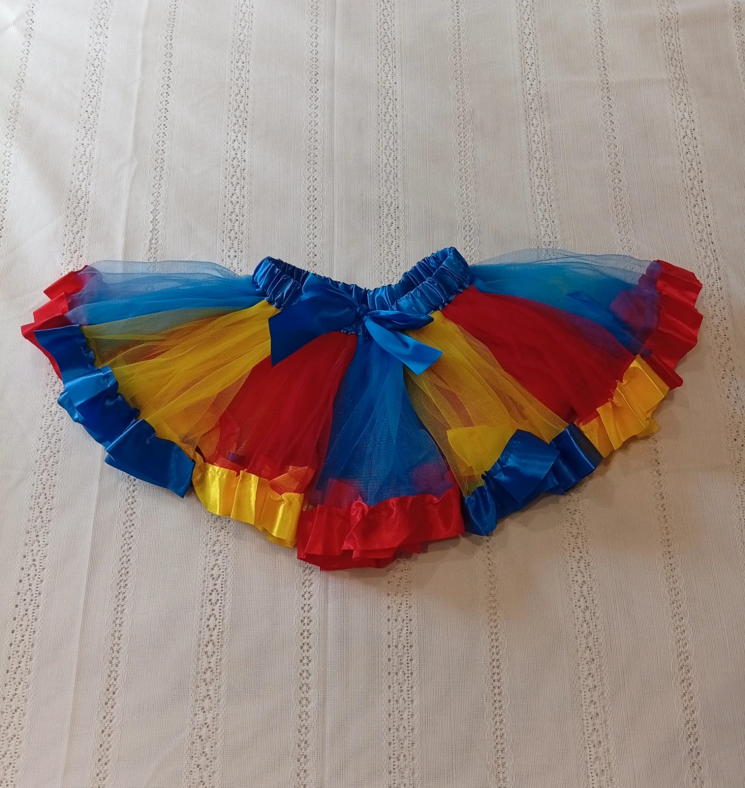 Beautiful layered tulle tutu skirt in vibrant colours, perfect for any occasion.
