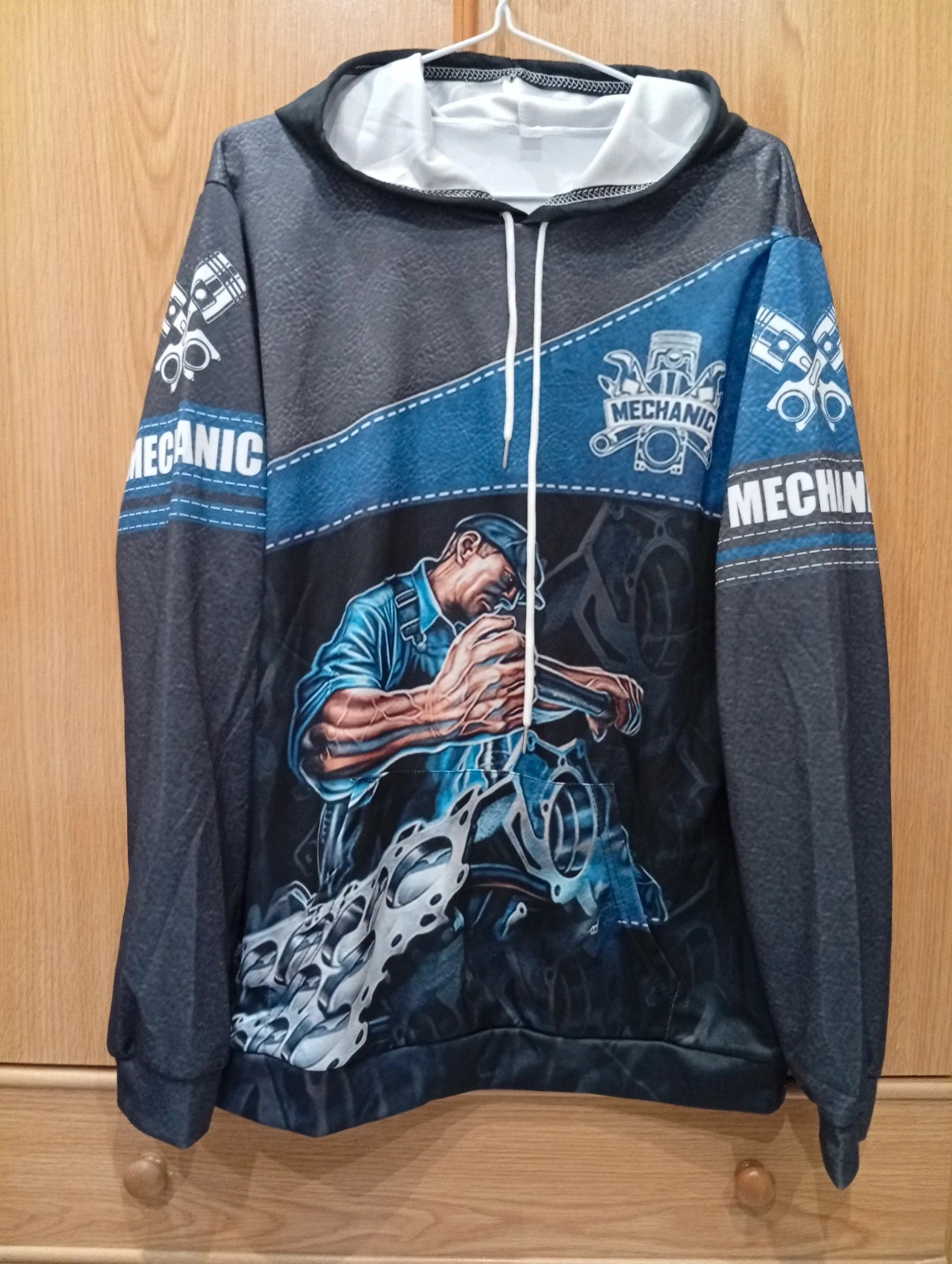 Stylish mechanic-themed hoodie featuring an engine design.