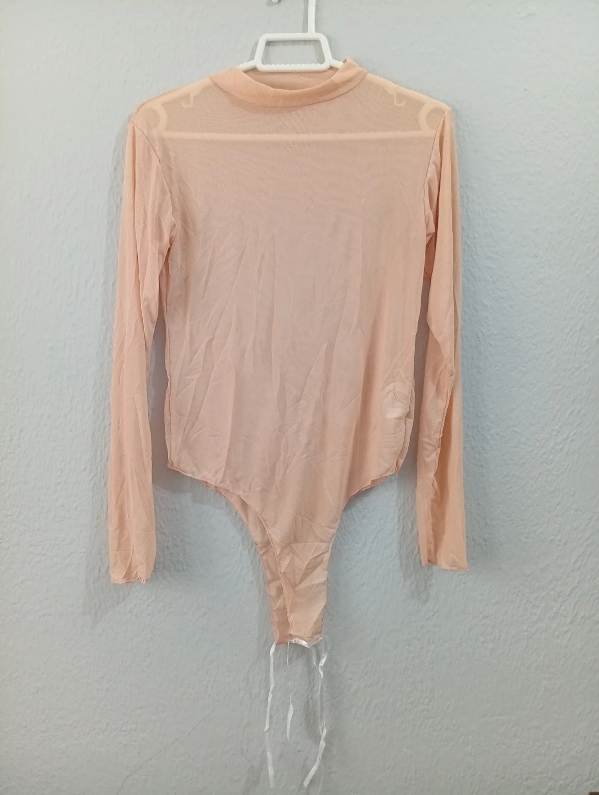 Beige long sleeve bodysuit Size S. Stretchy and comfortable fabric, perfect for casual outfits.