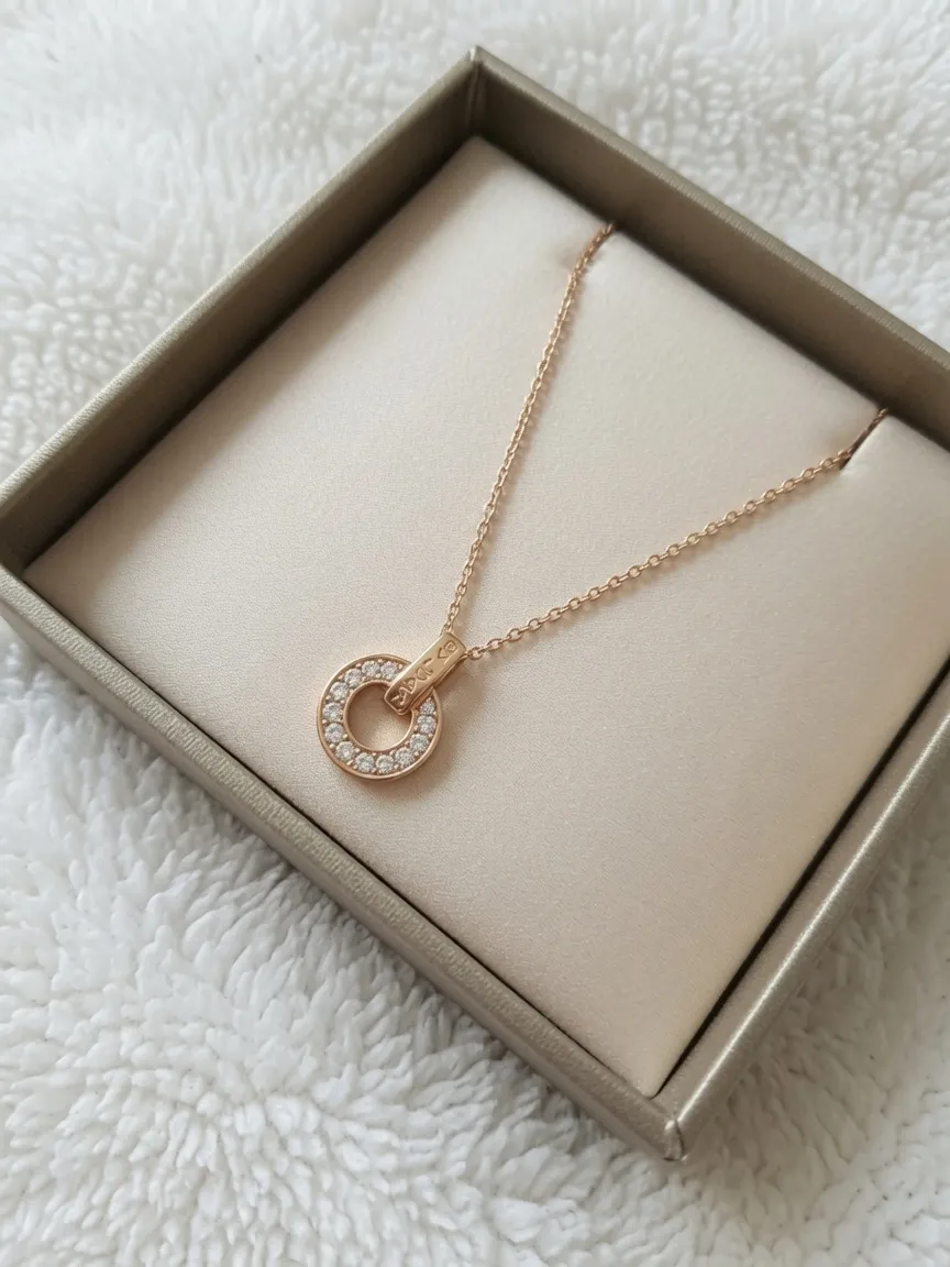 Collier pendentif cercle strass or rose
