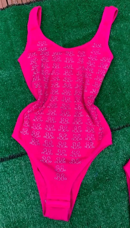 Maillot de bain une pièce rose fluo motifs