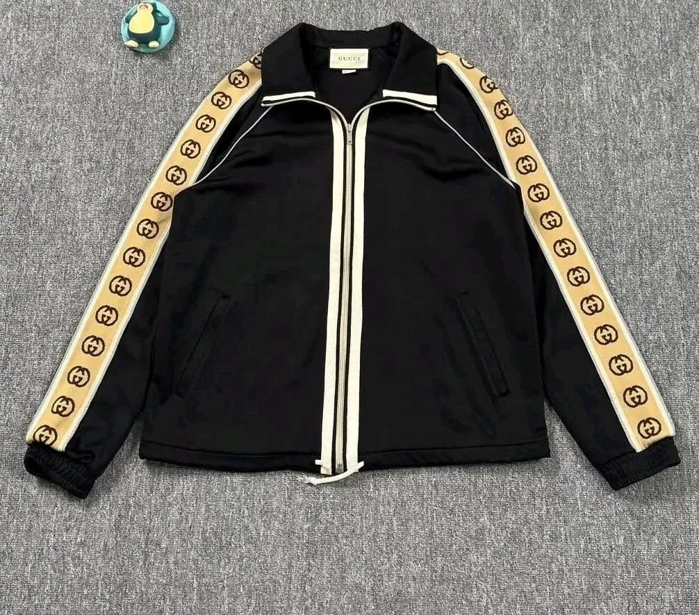 Gucci veste de sport noir bande GG or