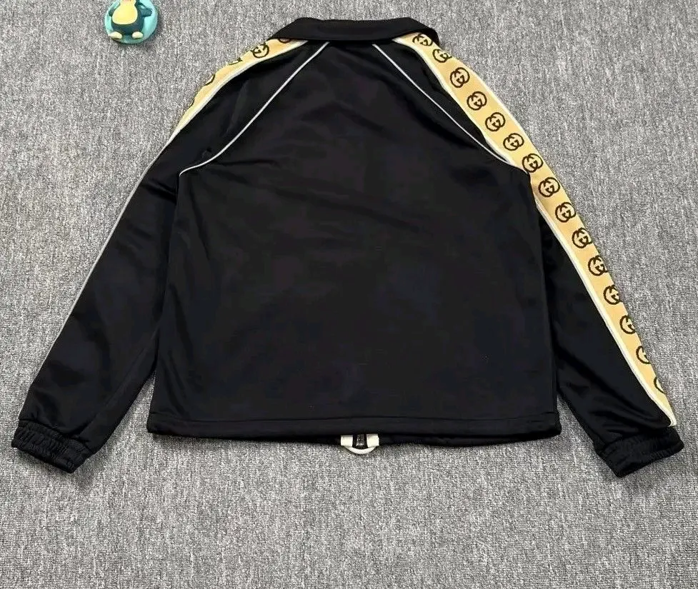 Gucci veste de sport noir bande GG or 4