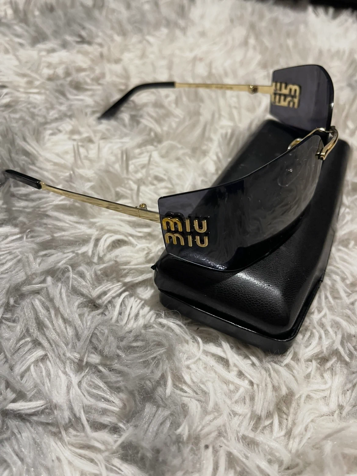 Lunettes Miu Miu oversize noires