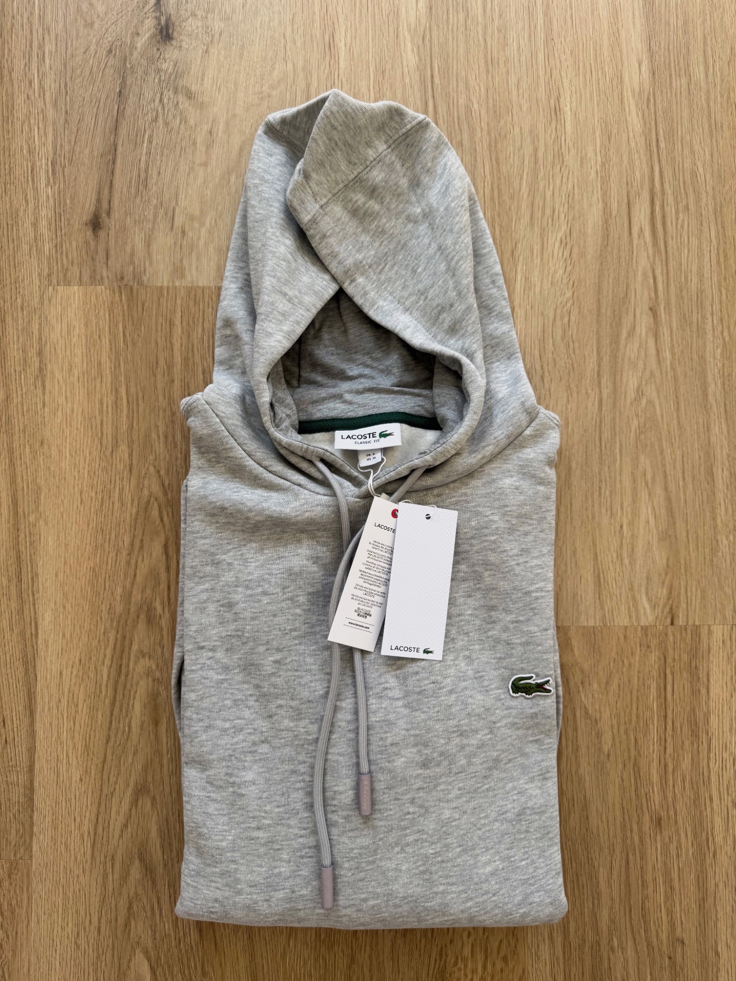 Sudadera Lacoste gris con capucha