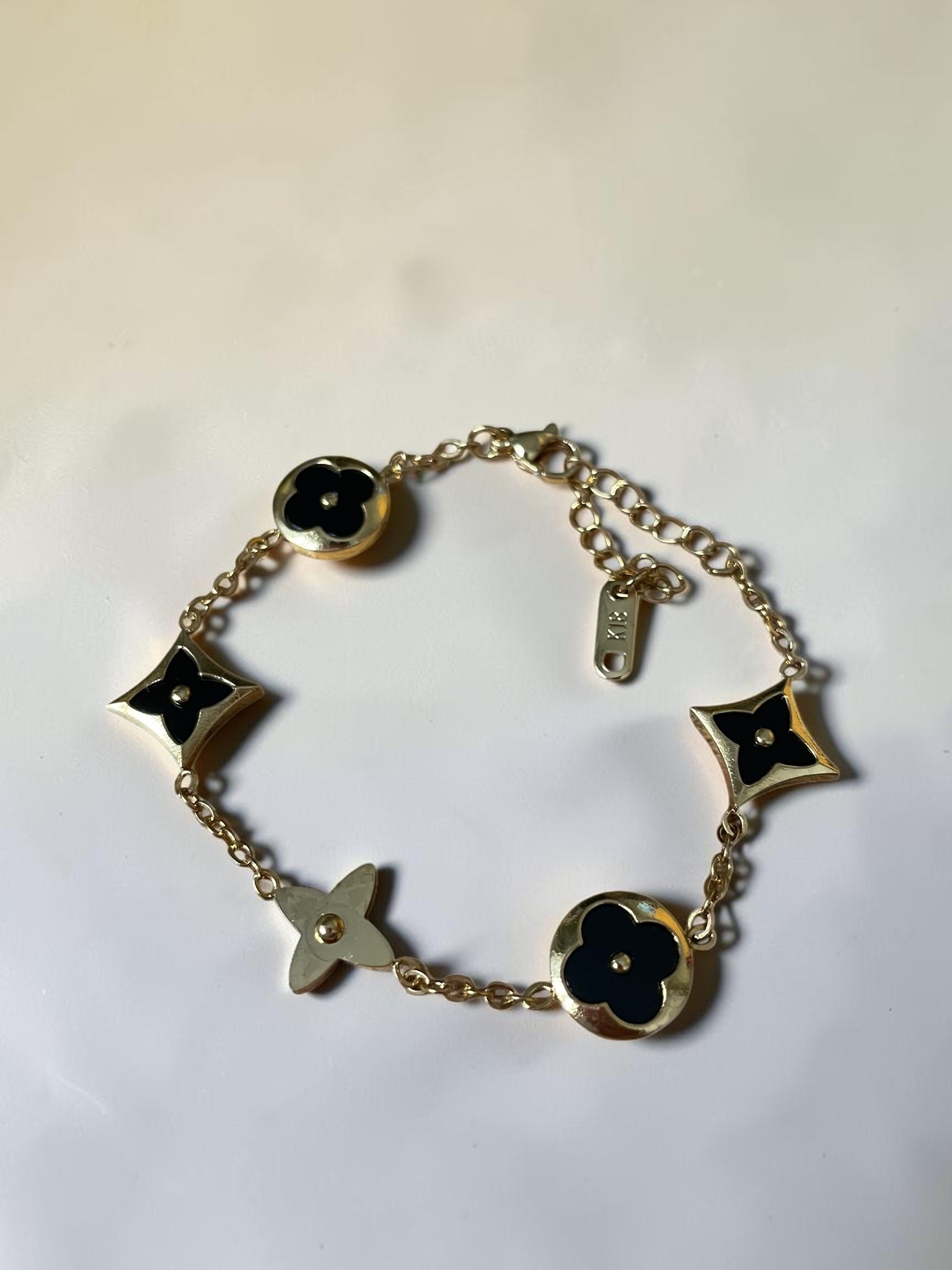 Bracelet chaîne or noir fleurs