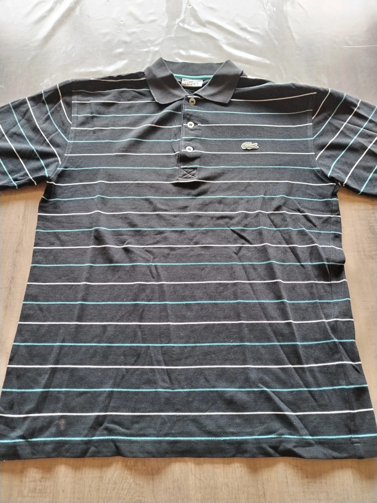 Polo à rayures Lacoste taille 3
