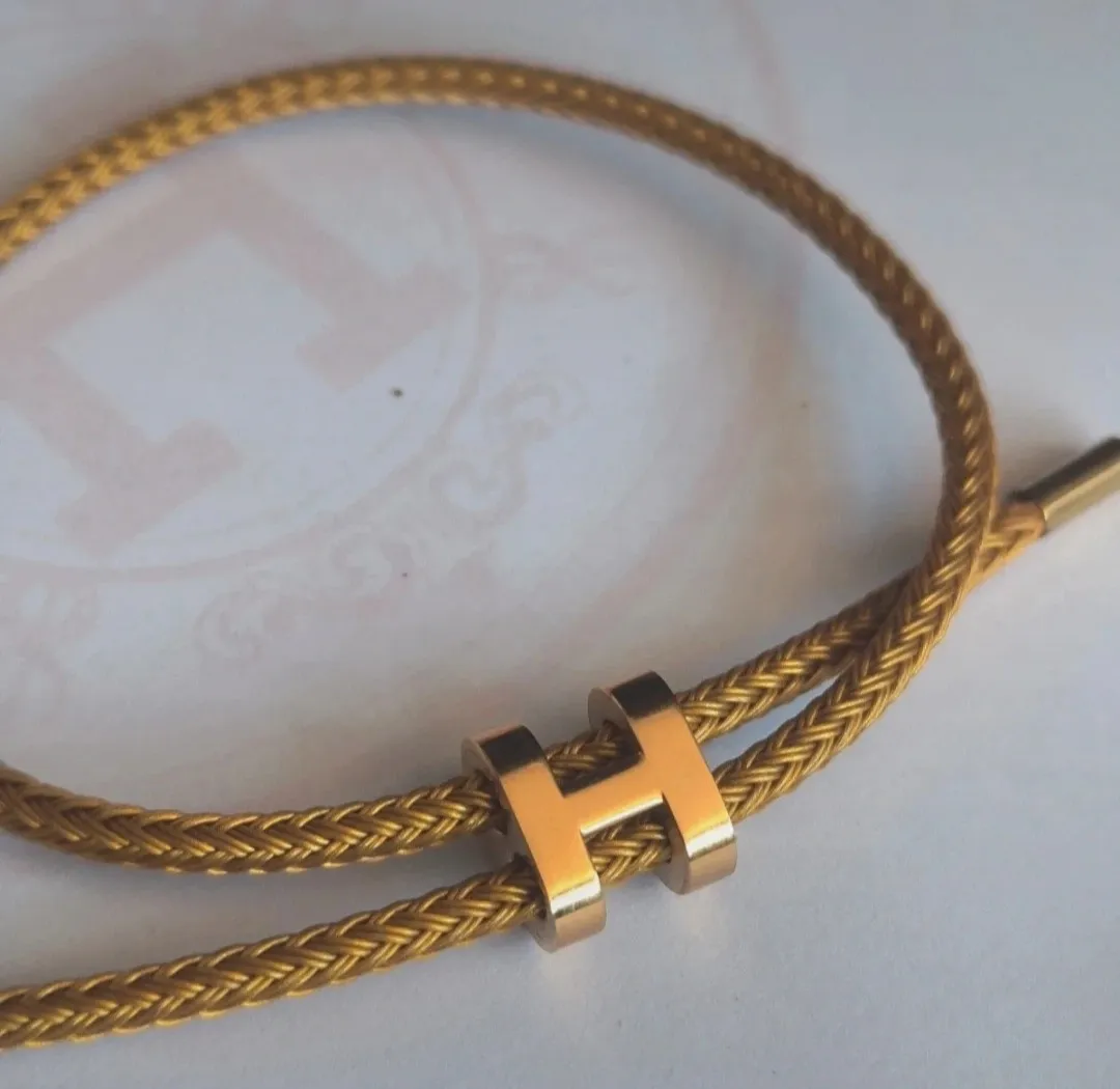 Bracelet jonc tressé doré fermoir H 5