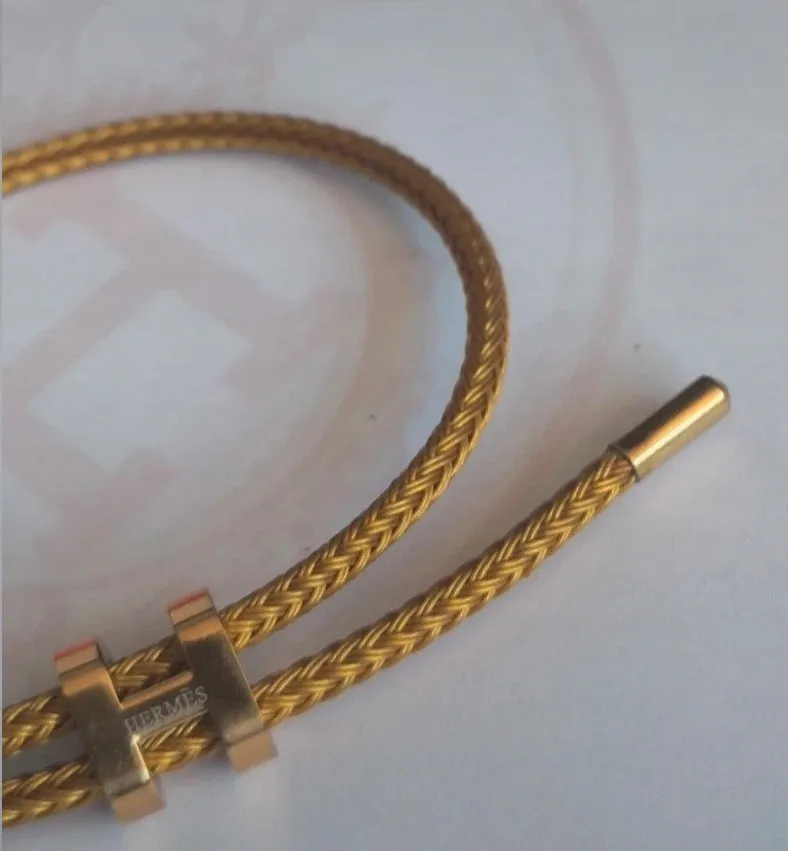 Bracelet jonc tressé doré fermoir H 3