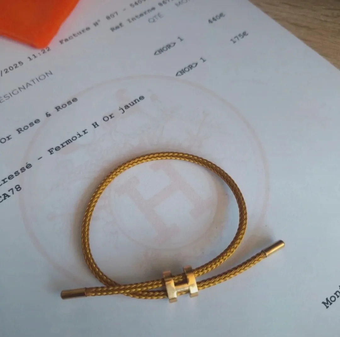 Bracelet jonc tressé doré fermoir H 7