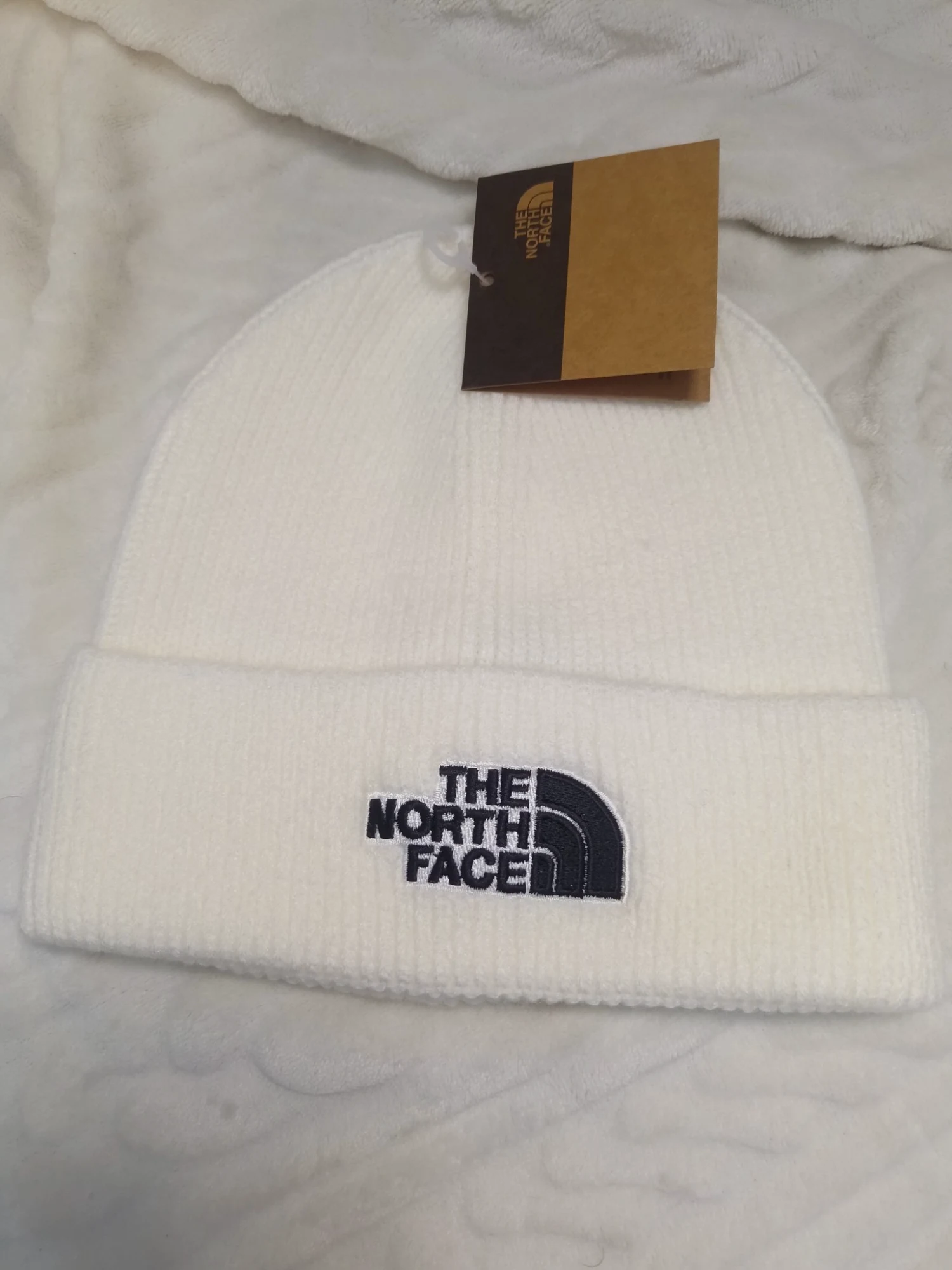 Bonnet blanc The North Face avec étiquette