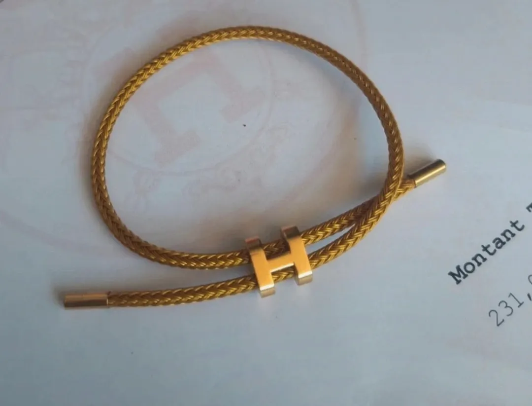 Bracelet jonc tressé doré fermoir H 6