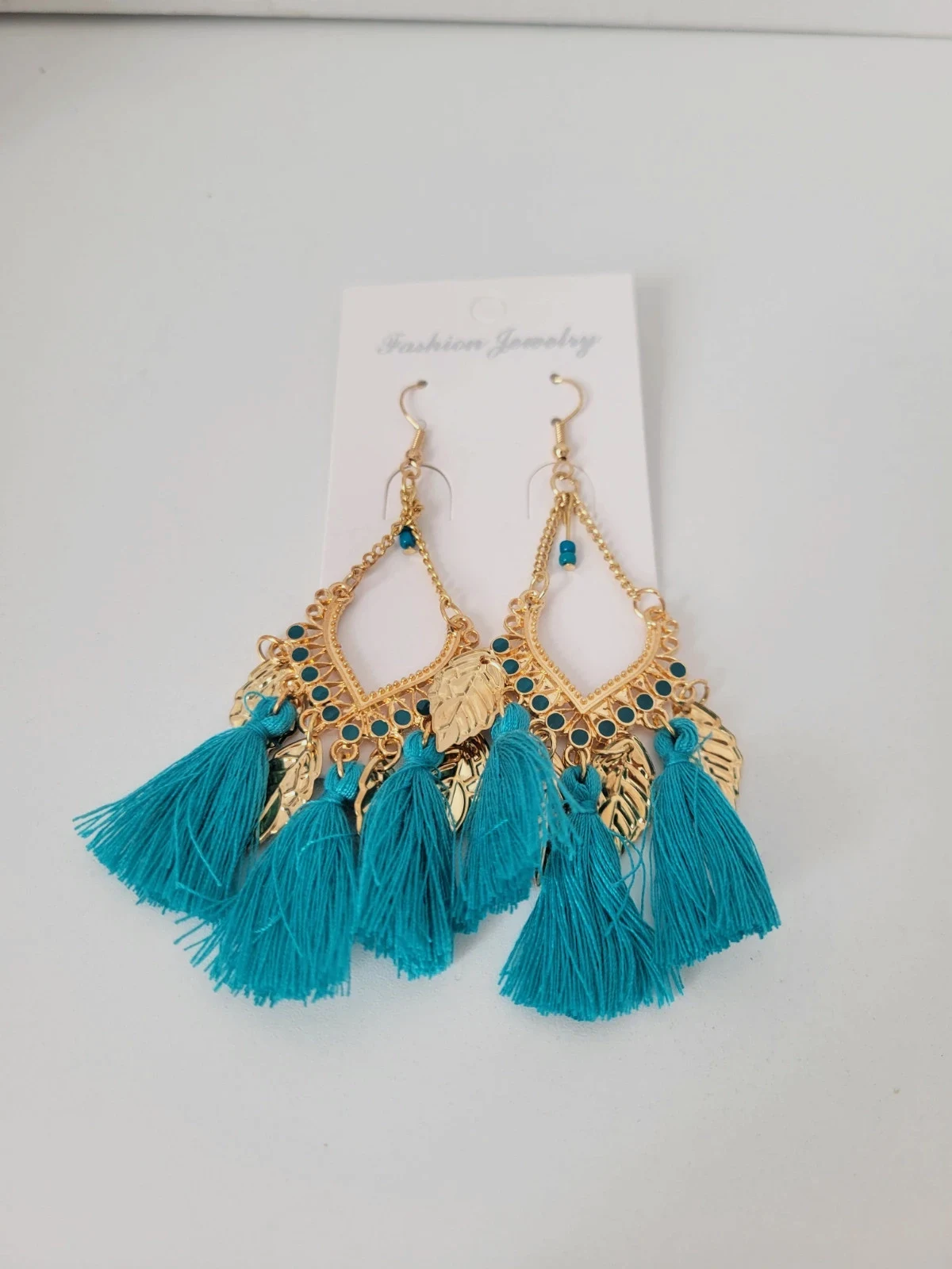 Boucle d'oreille doré bleu