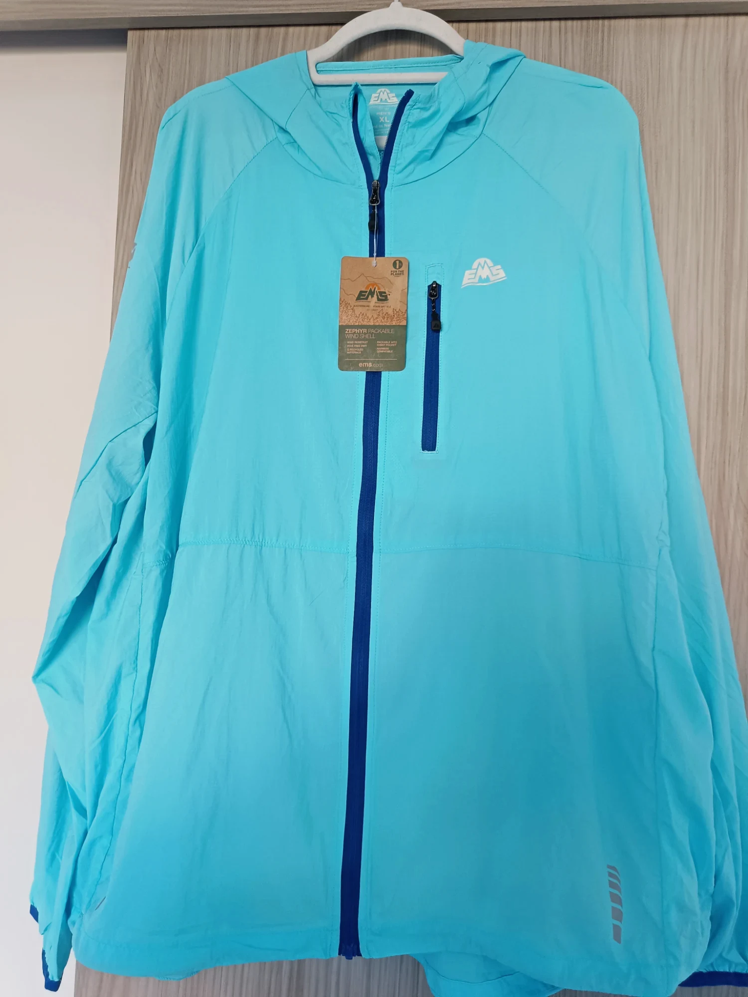 Chaqueta cortavientos EMS azul turquesa con capucha – EMS – taille XL