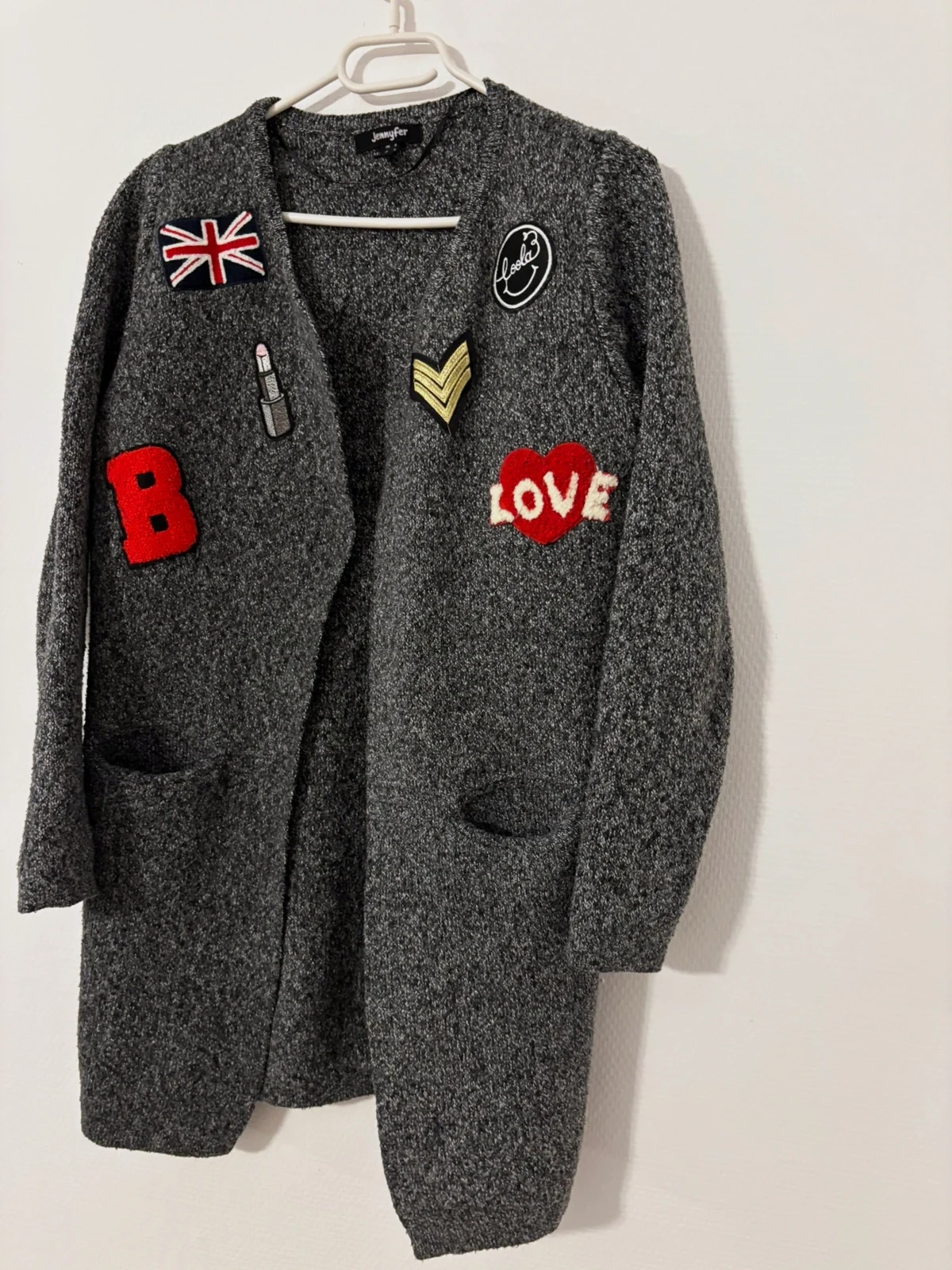 Gilet long gris à écussons