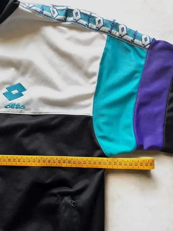 Veste de survêtement Lotto multicolore – Iro – blanche et noire avec empiècements turquoise et violets 2