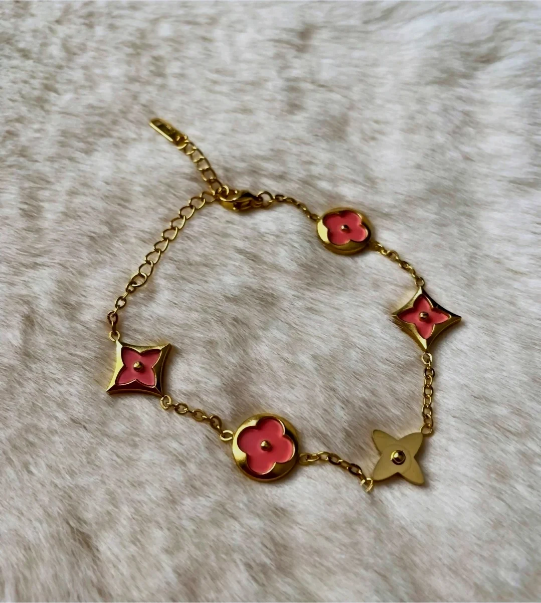 Bracelet chaîne fleurs étoiles doré