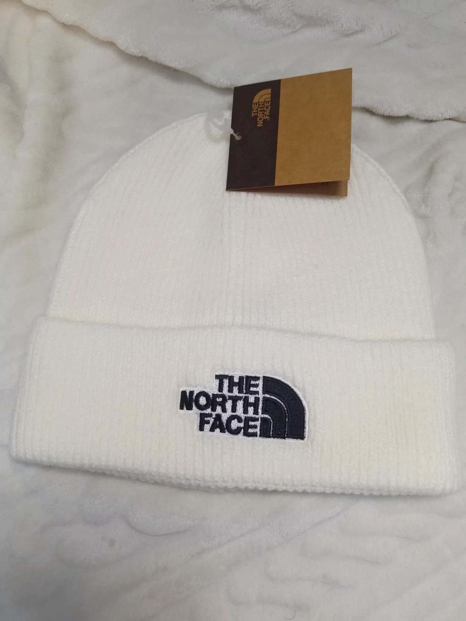 Bonnet blanc The North Face avec étiquette