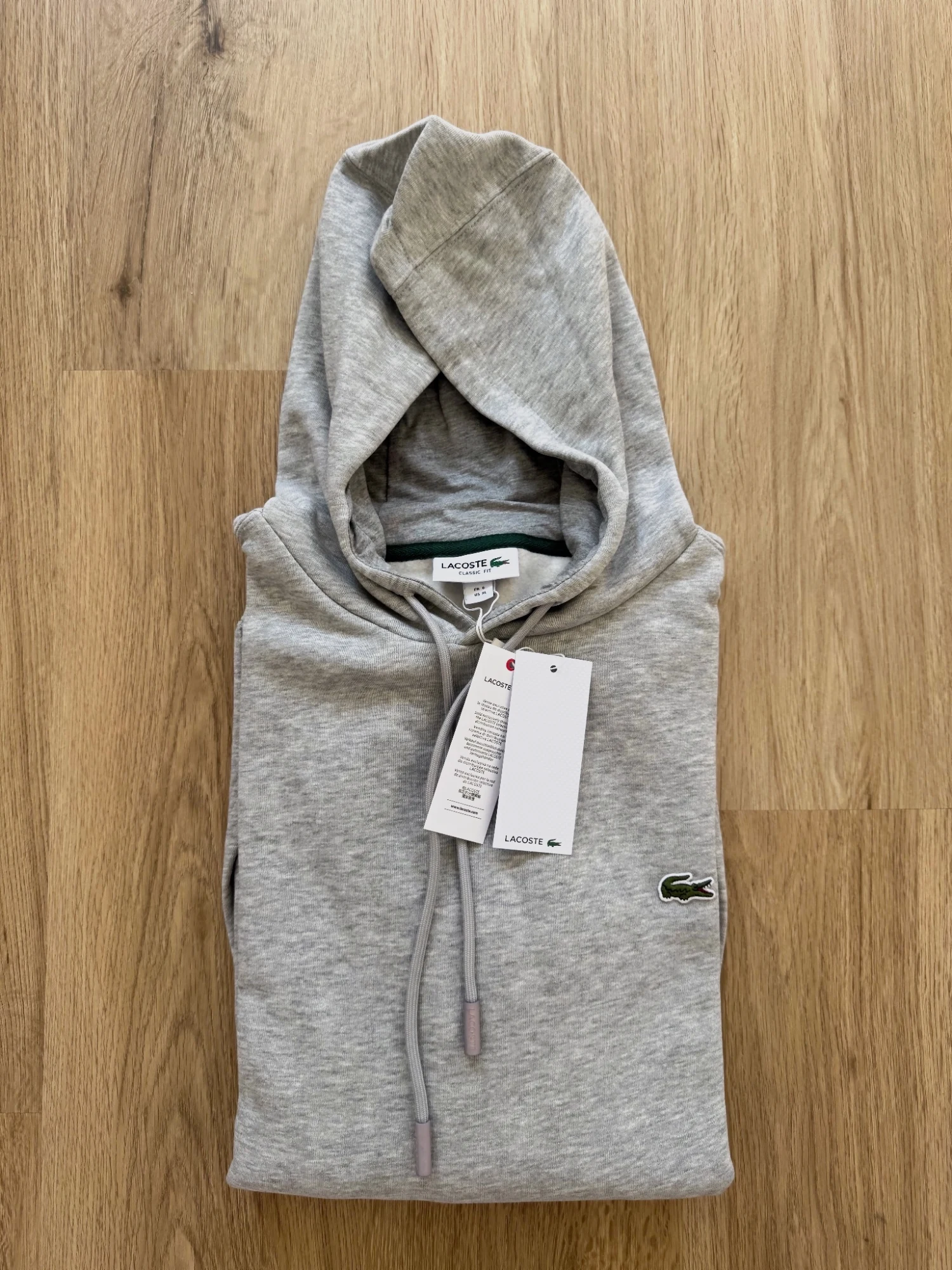 Sudadera Lacoste gris con capucha 