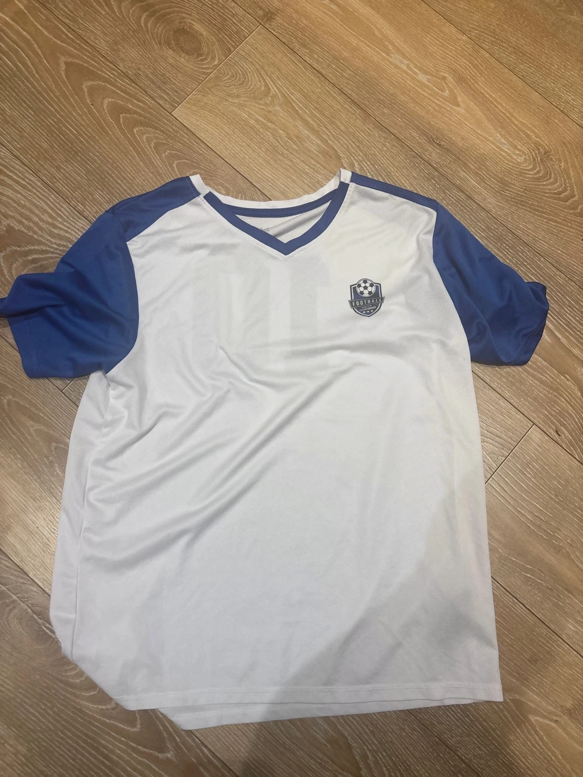 Maillot de sport Homme marque Crivit Blanc et Bleu numéro 10 taille L