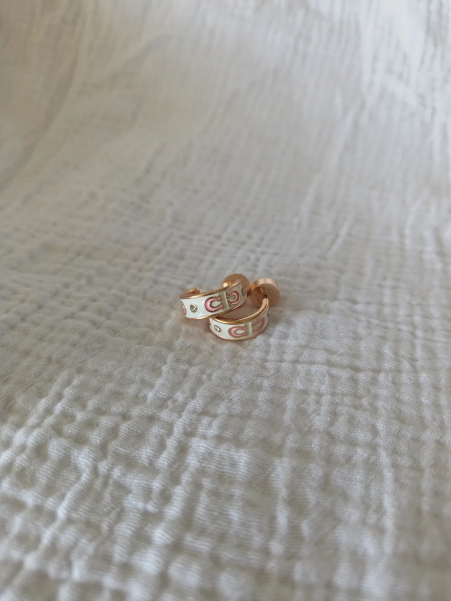 Boucles d'oreilles coach or rose neuves