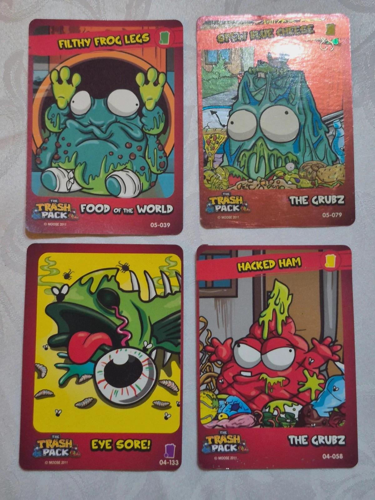 Lot de 4 cartes Trash Pack 2011 – The Trash Pack