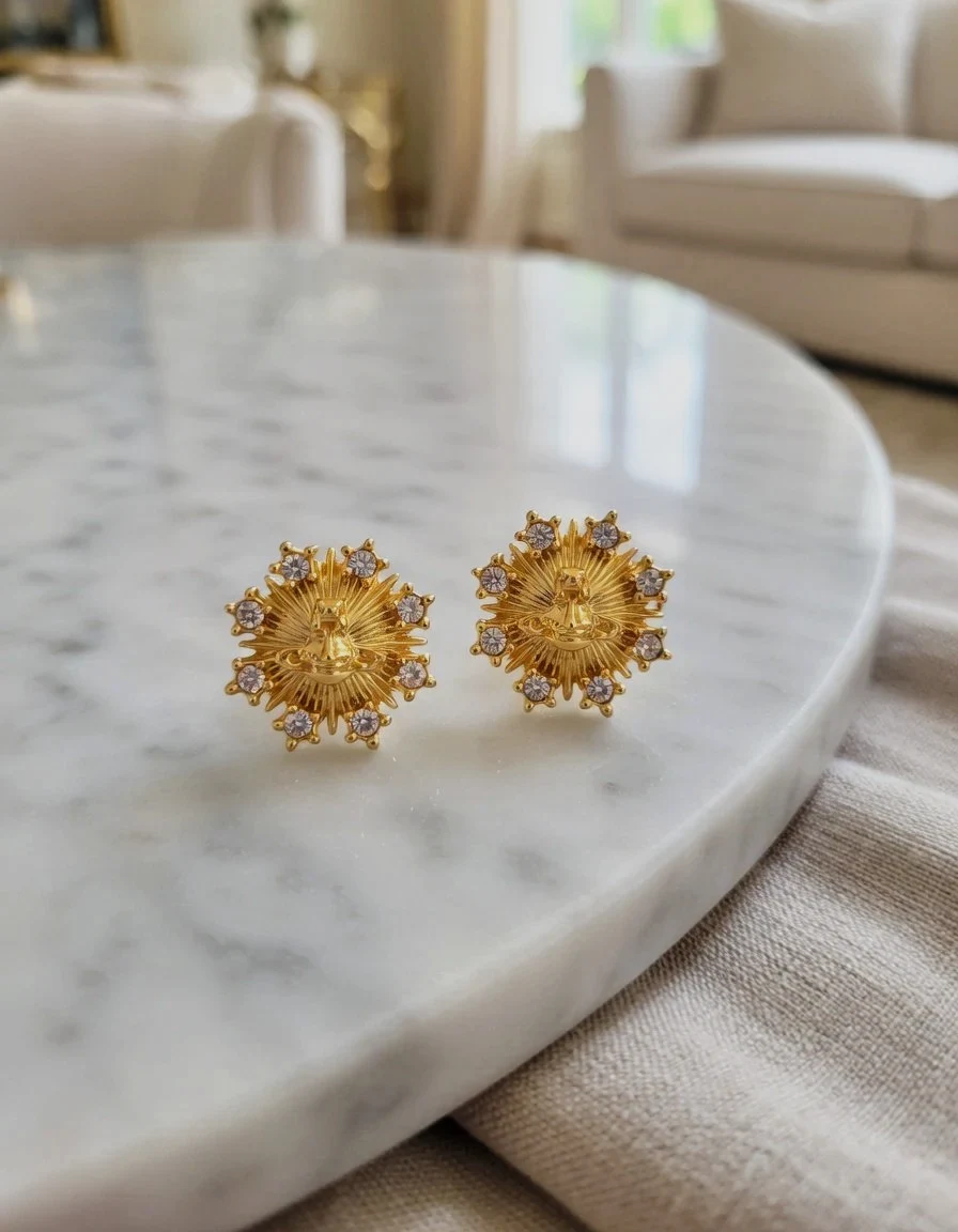 Boucles d'oreilles soleil dorées Vivienne Westwood