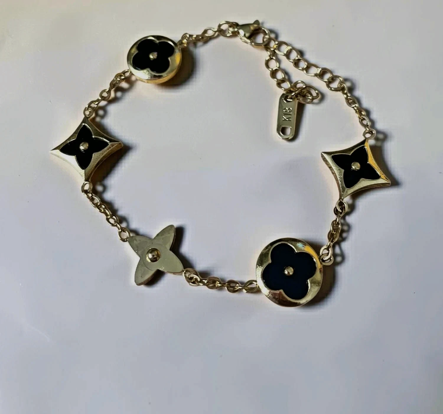 Bracelet chaîne or noir fleurs