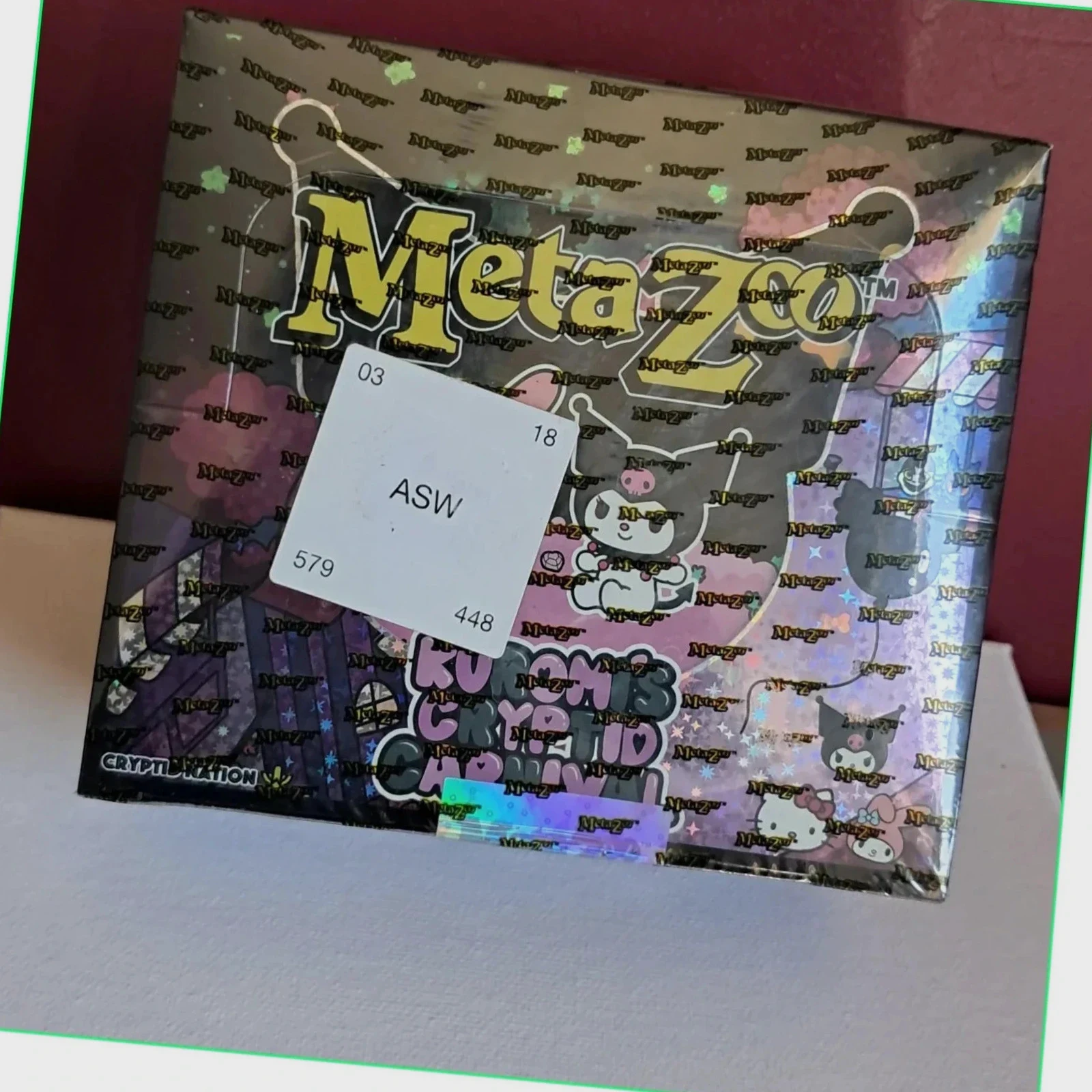 Booster Box MetaZoo TCG – Kuromi's Cryptid Carnival sous blister (scellé et neuf)