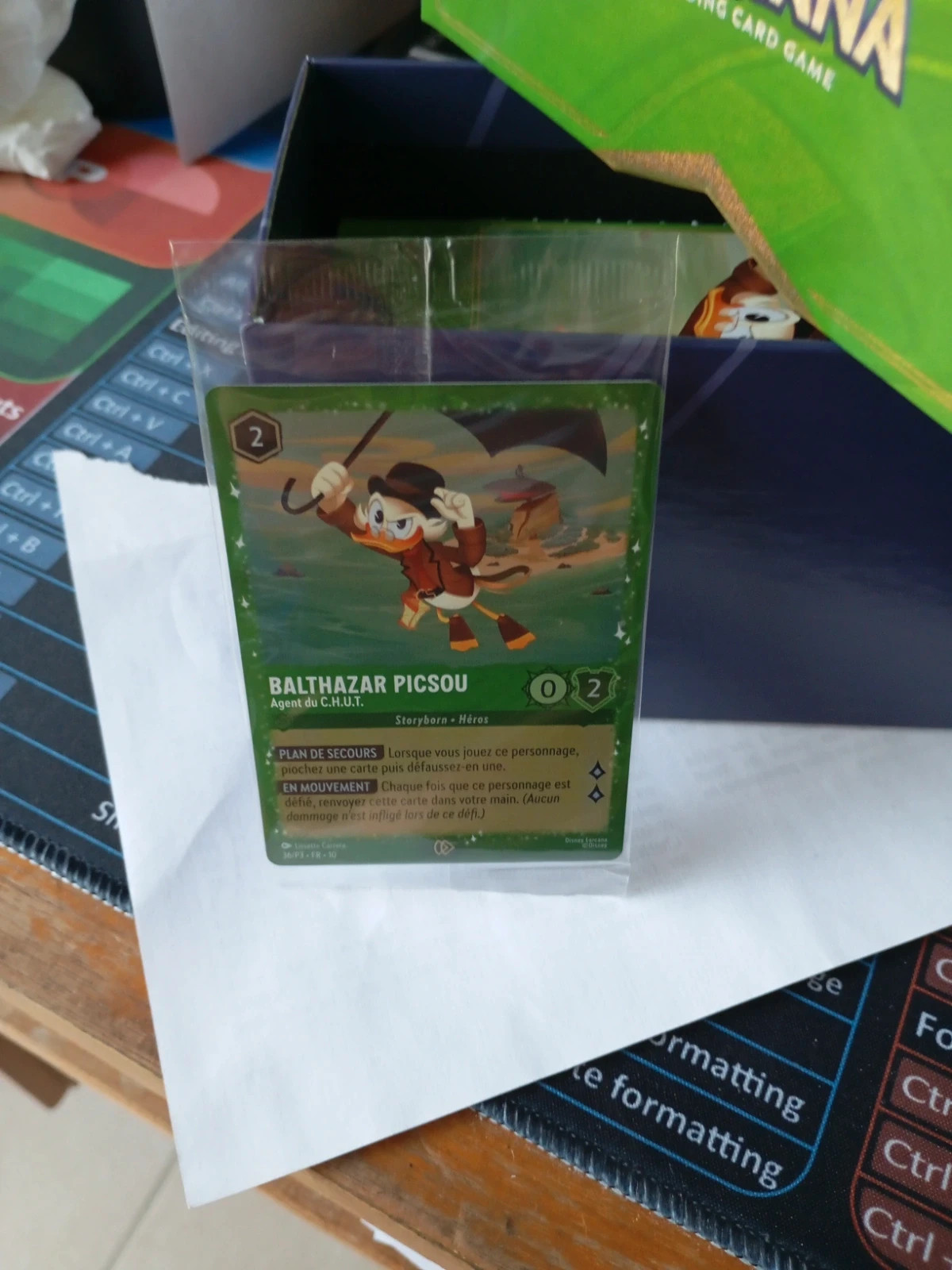 Boite vide de boosters mais avec carte piscou Lorcana – Disney 2