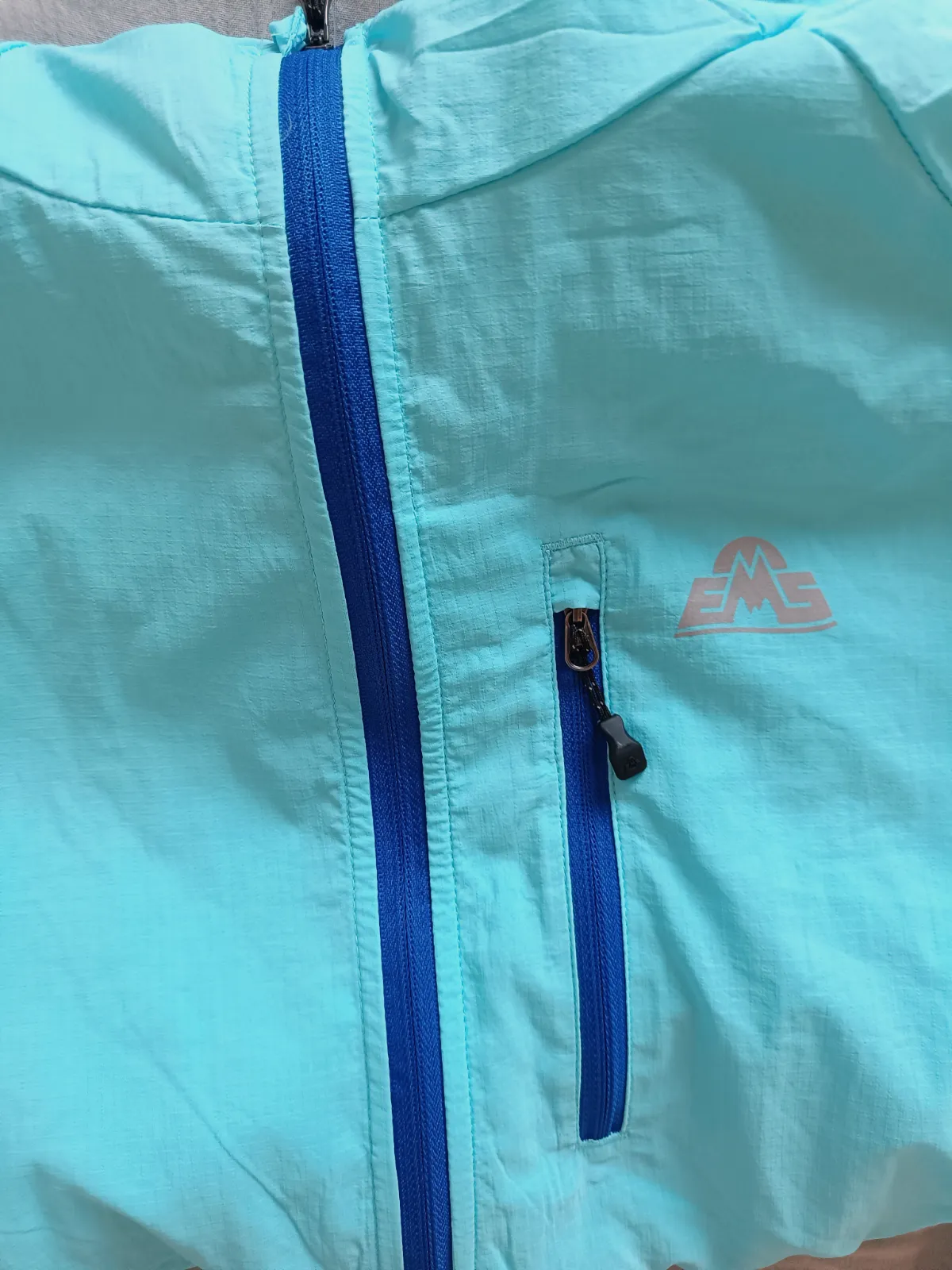 Chaqueta cortavientos EMS azul turquesa con capucha – EMS – taille XL 2