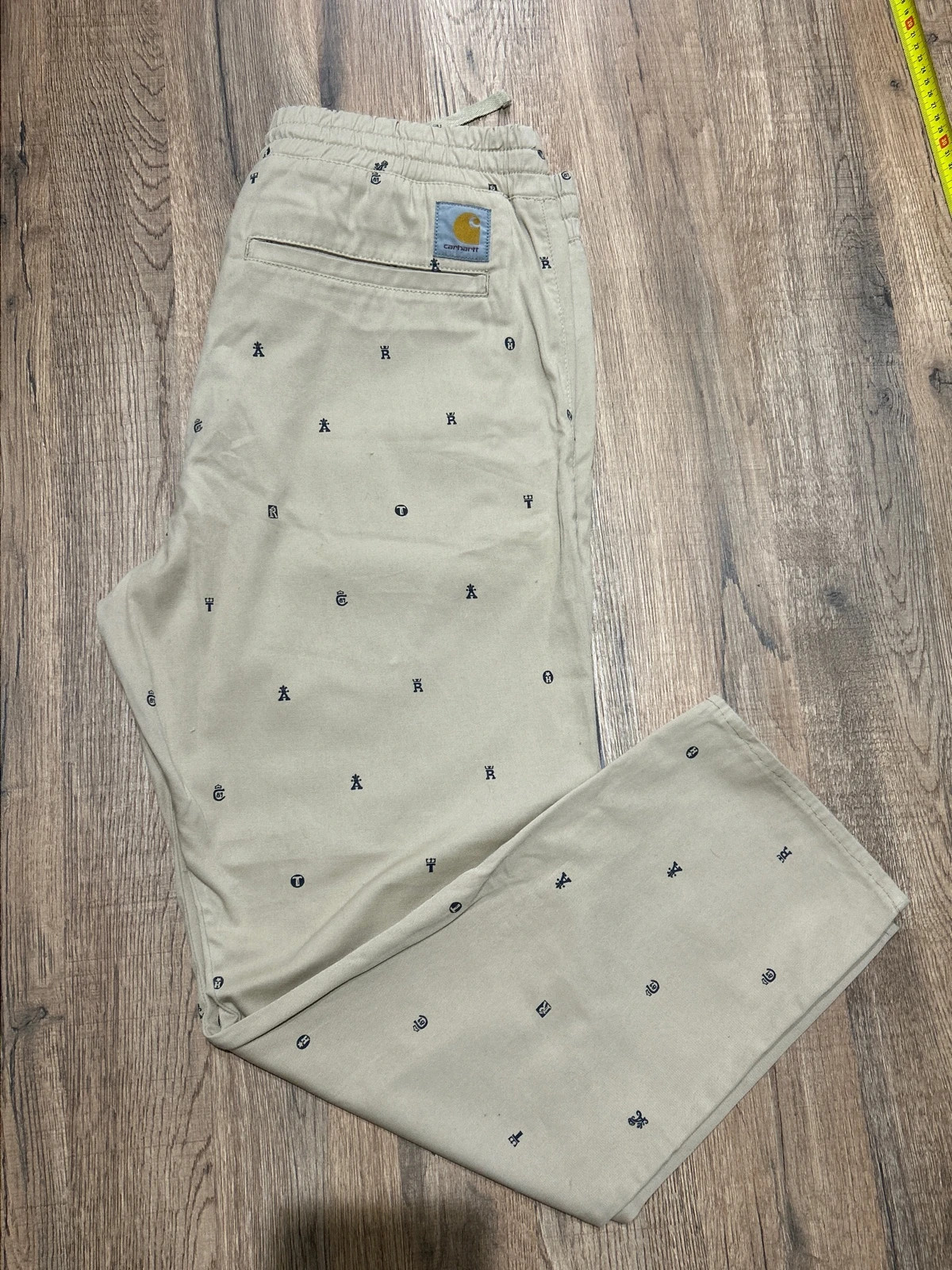Pantalon Carhartt (6) WIP Madison Jogger Beige All Over Print Logos Taille M Chino