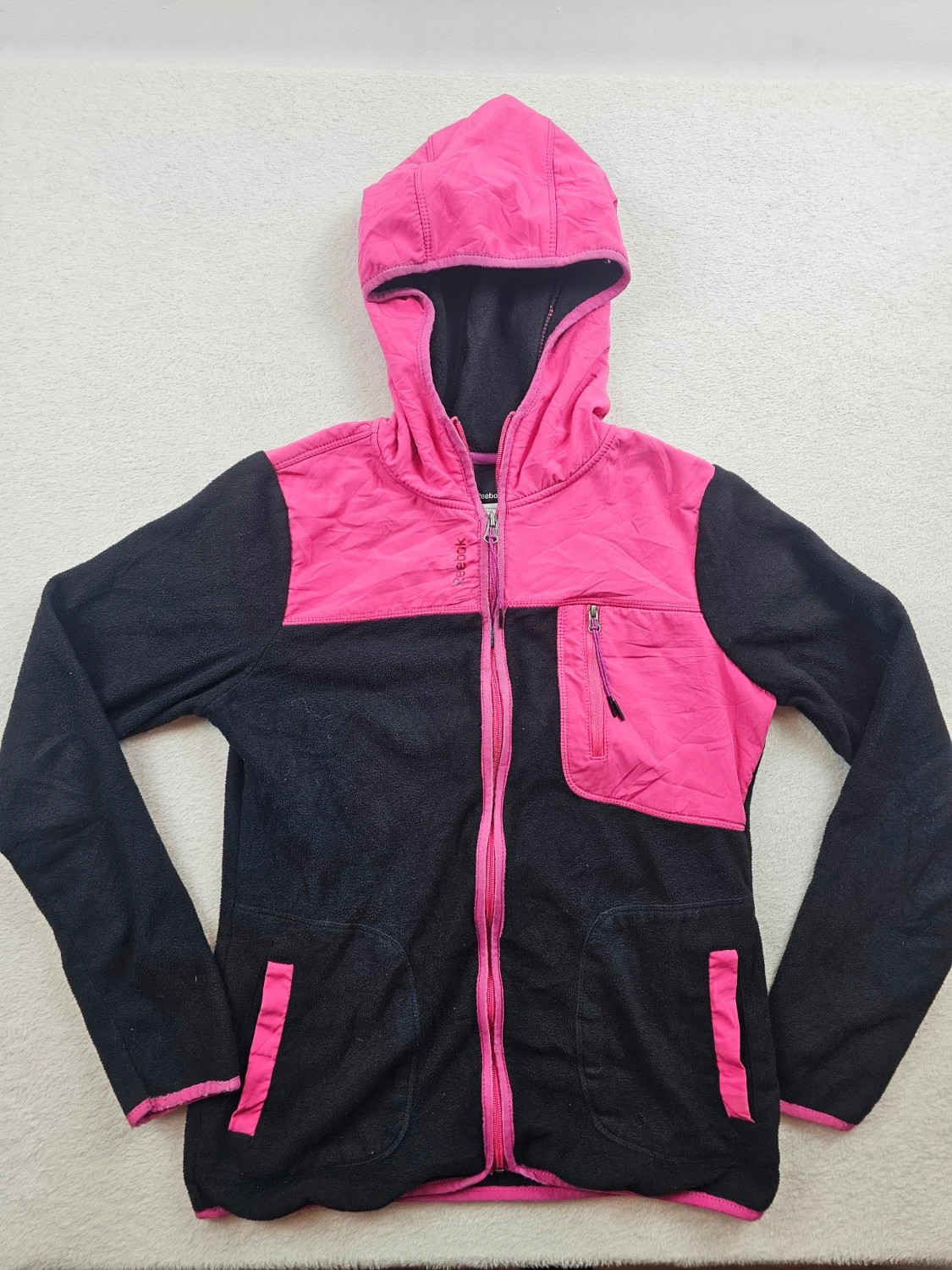 Veste polaire Reebok capuche zippée empiècements contrastants noir et rose Femme taille S