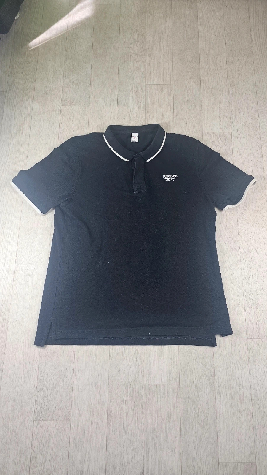 Polo Reebok noir homme L