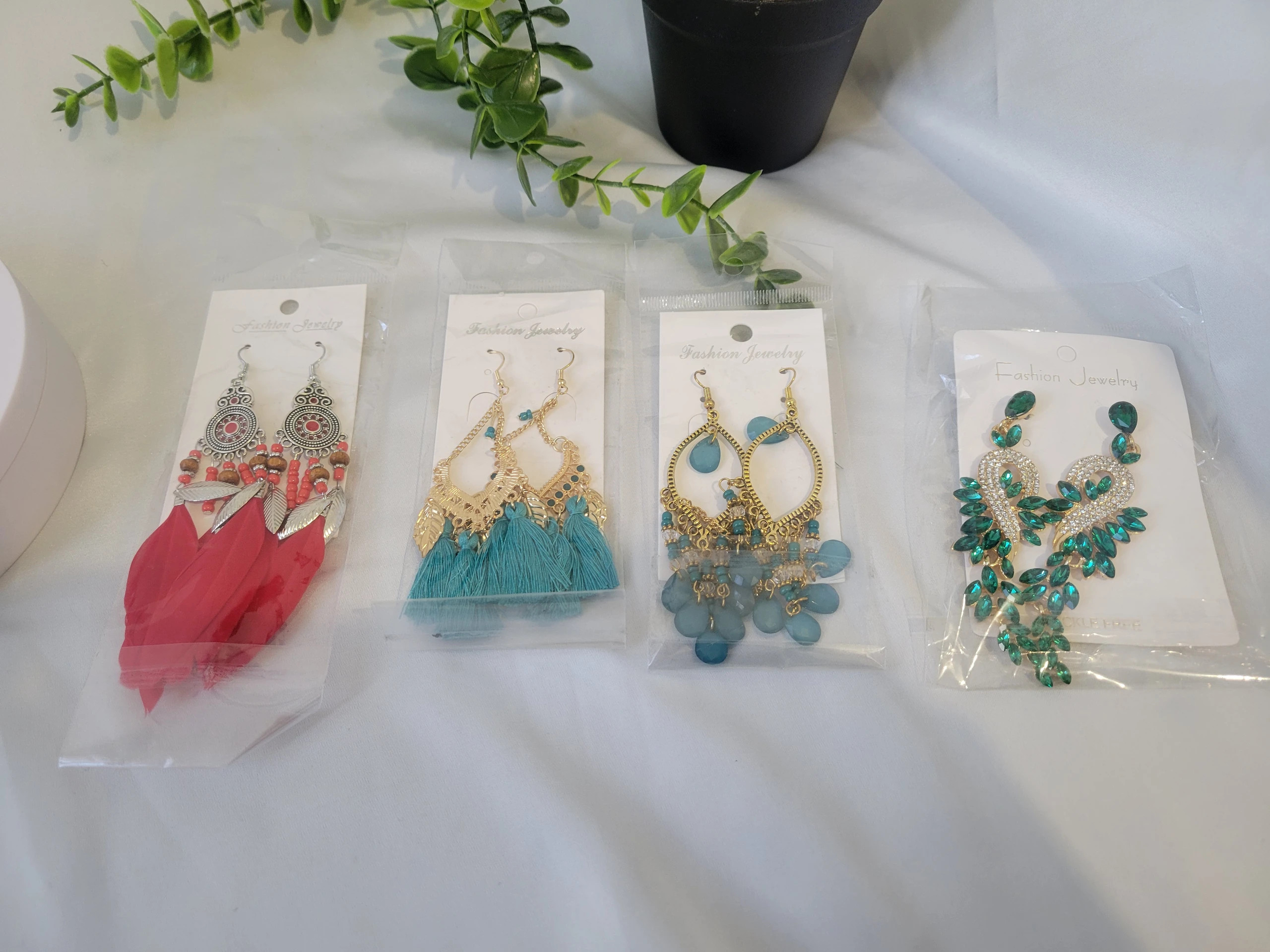Boucles d'oreilles en plumes rouge 4