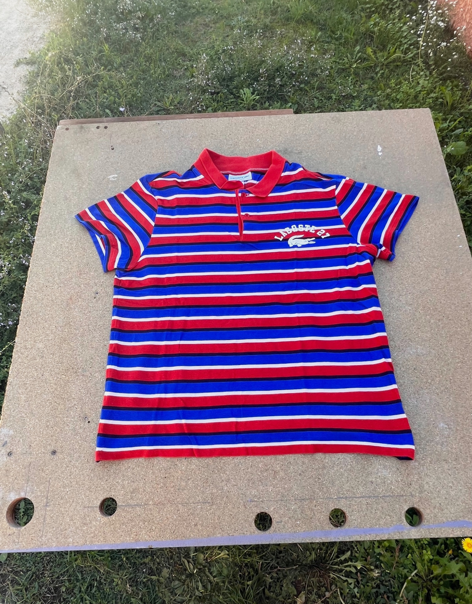 Polo Lacoste à rayures taille M