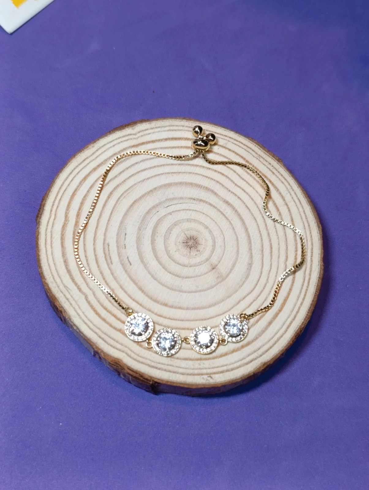 Pulsera acero dorado con cuatro circonitas