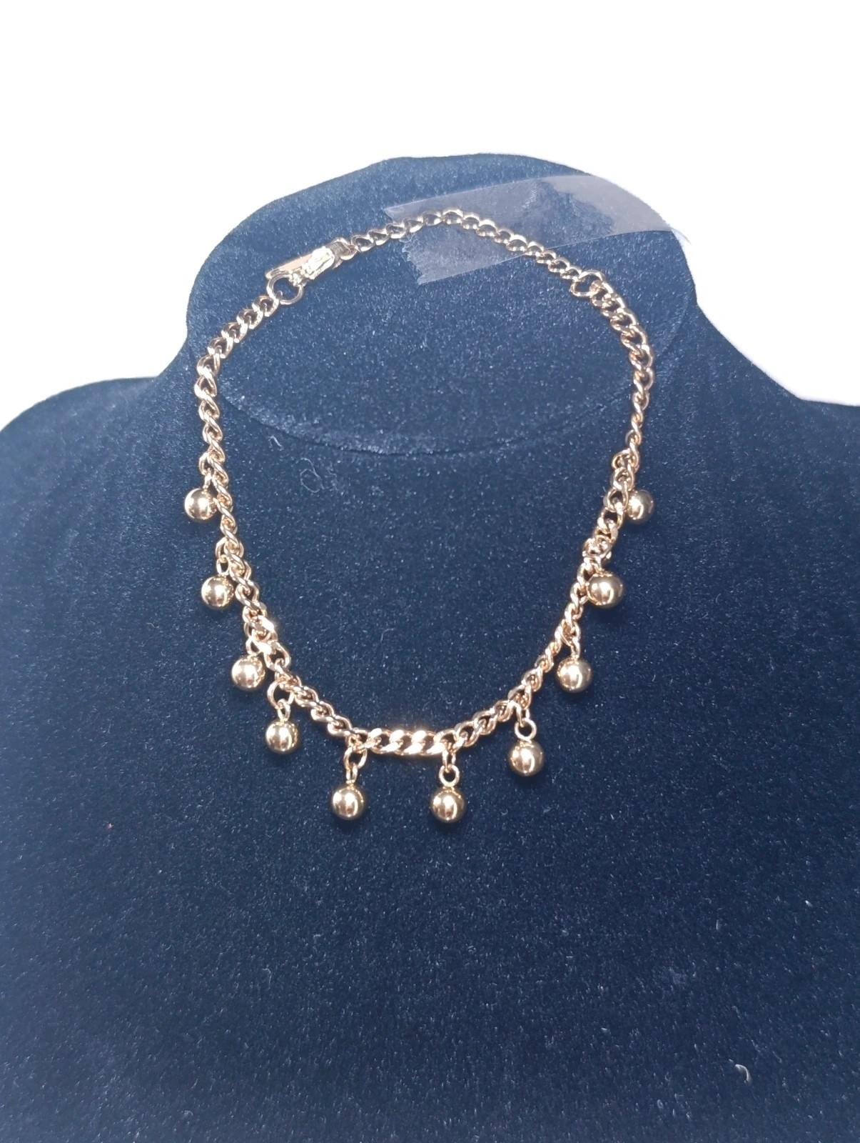 Pulsera acero dorado con bolitas colgantes