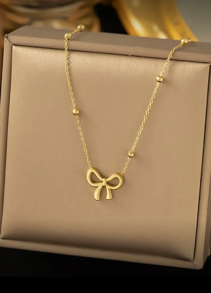 Collier nœud strass doré 3