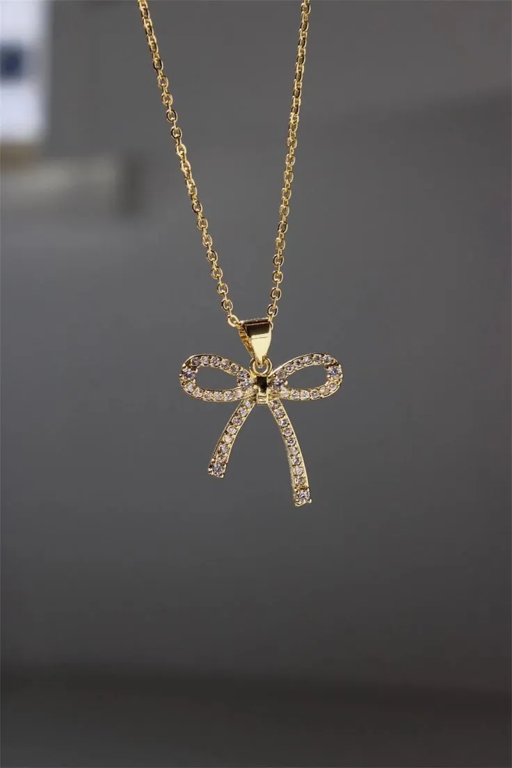 Collier nœud strass doré