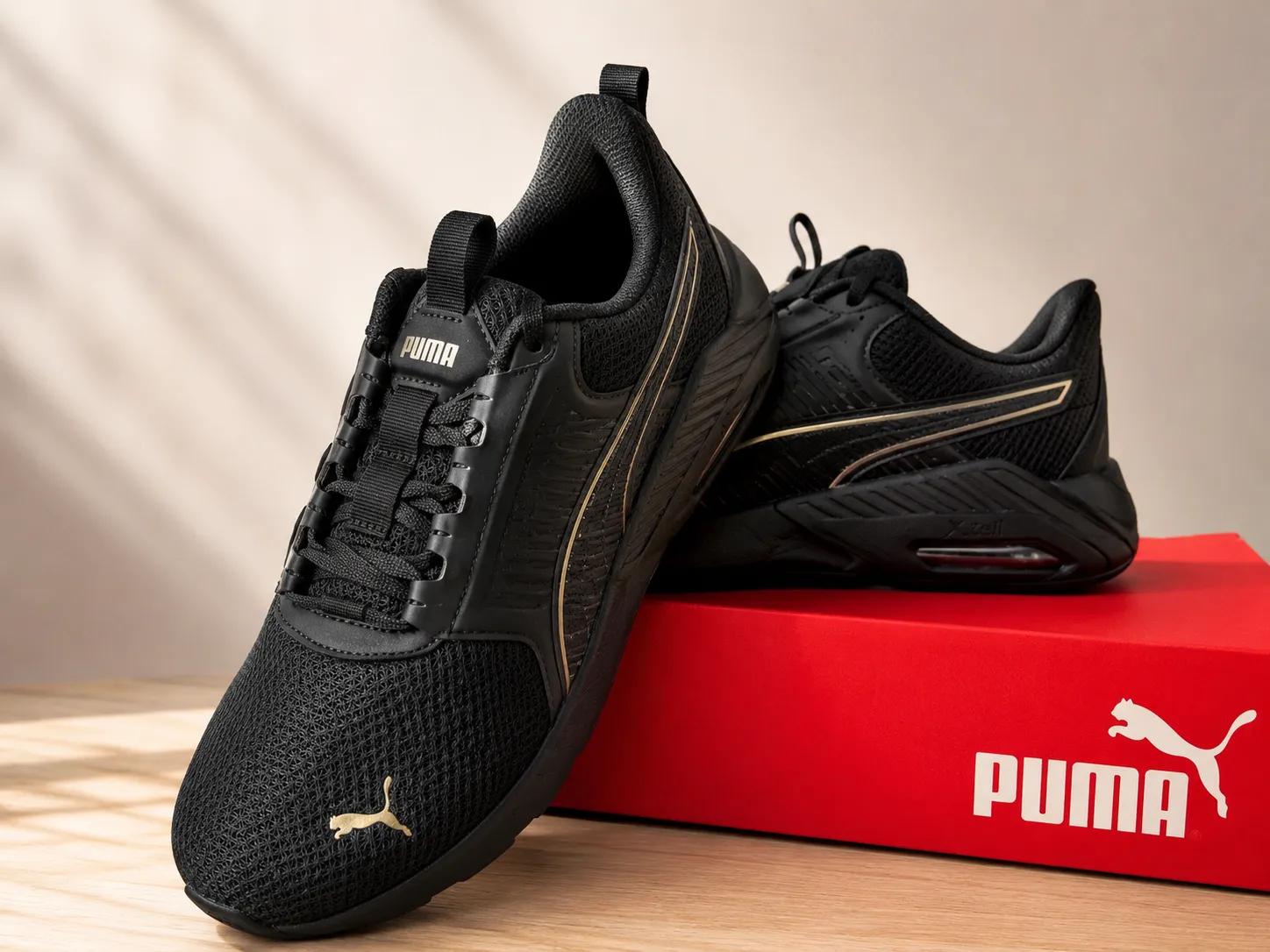 Puma baskets noires doré