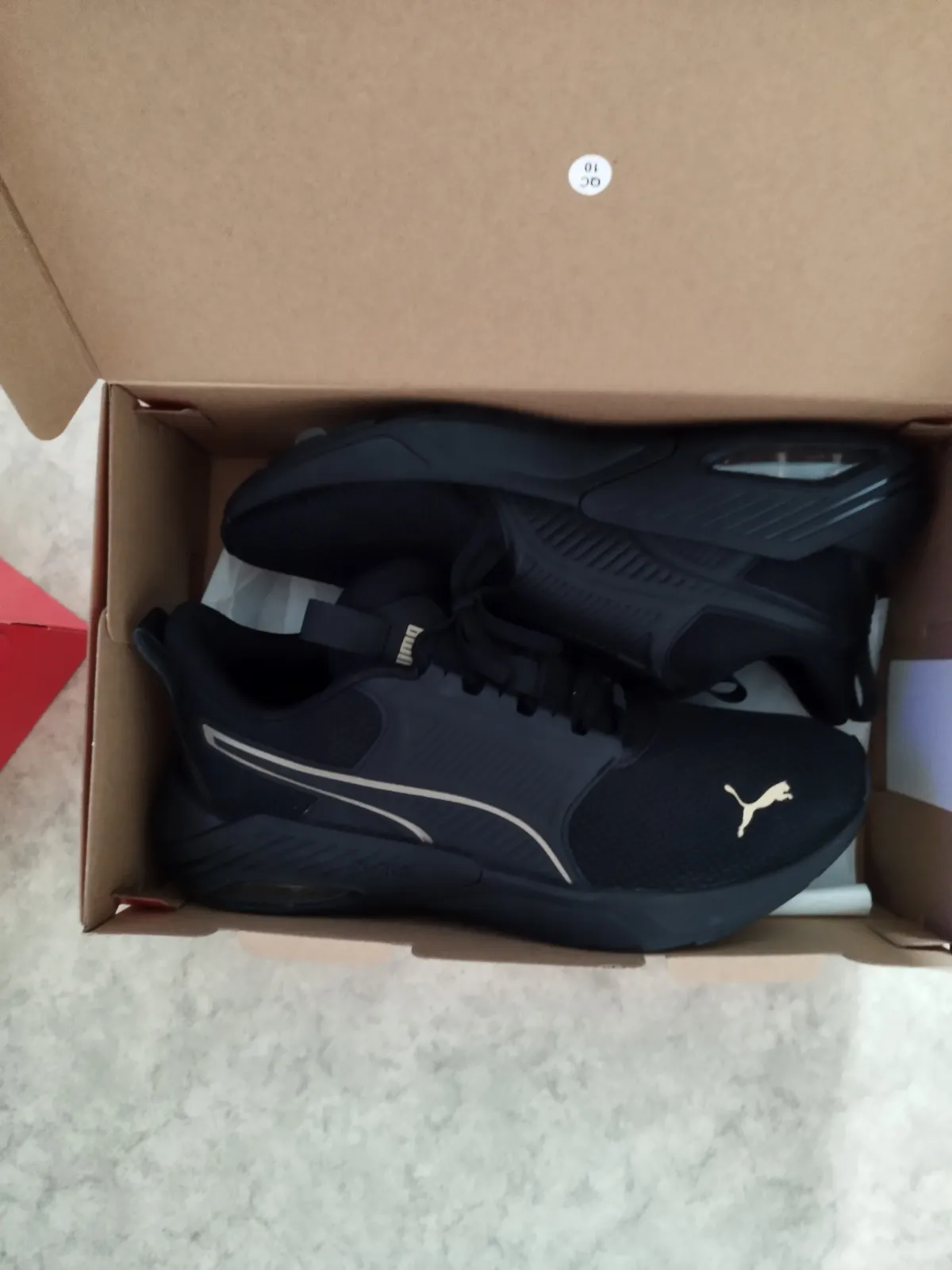 Puma baskets noires doré 2
