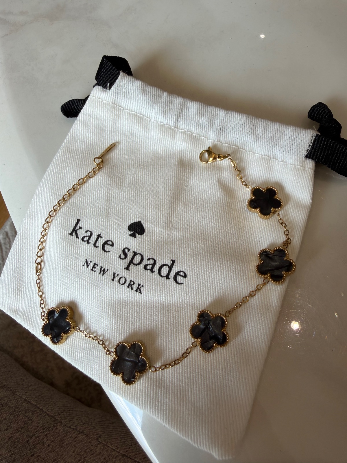 Bracelet Kate Spade trèfle noir or