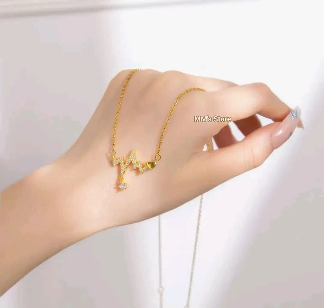 Collier pendentif cœur battement doré strass