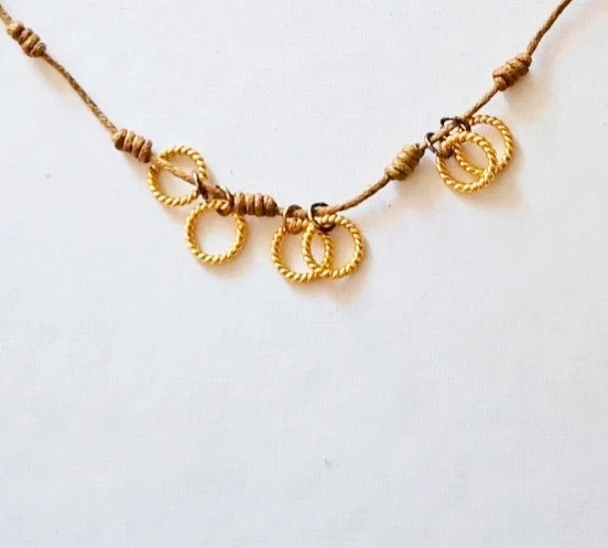 Boho knotted necklace · Coin charms · Local artisan piece · Earthy tones 3
