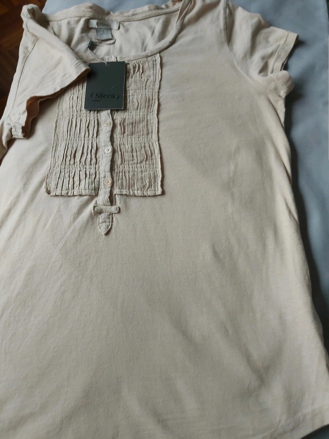 Tee shirt avec un plastron taille L.