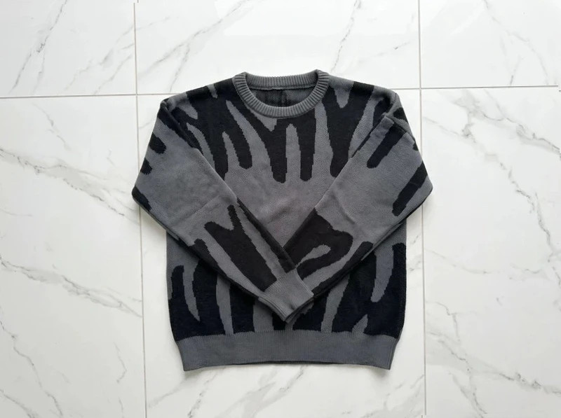 Pull noir et gris À motif graphique